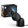 Schwarze Philips Hue Secure Kamera mit Standfuß und Verpackung. Ideal für die Videoüberwachung.