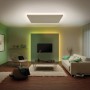 Wohnzimmer mit Paulmann MaxLED RGBW Streifen, der farbiges und warmweißes Licht spendet.