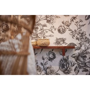 Vliestapete mit floralem Muster in Schwarz und Perlweiß, leicht strukturiert und glänzend.