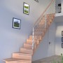 Gewendelte Buchenholztreppe Lindos Pro mit Edelstahlgeländer und Setzstufen.