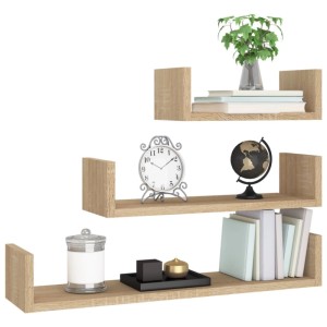 Drei U-förmige Wandregale in Sonoma-Eiche Holzwerkstoff, dekoriert mit Büchern und Pflanzen. Ideal für Wohnzimmer.