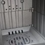 Brennraum des Plamen Kaminofen Dora 10N Grün mit Herdplatte, Gusseisen, Rost und Luftzufuhr sichtbar.