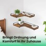 Eckregal Barnet-old im Industrie-Design in Braun-Schwarz mit Deko an einer weißen Wand.