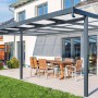 Anthrazitfarbenes Gutta Terrassendach Premium mit Acryl Stegplatten und Sitzgruppe auf Terrasse.