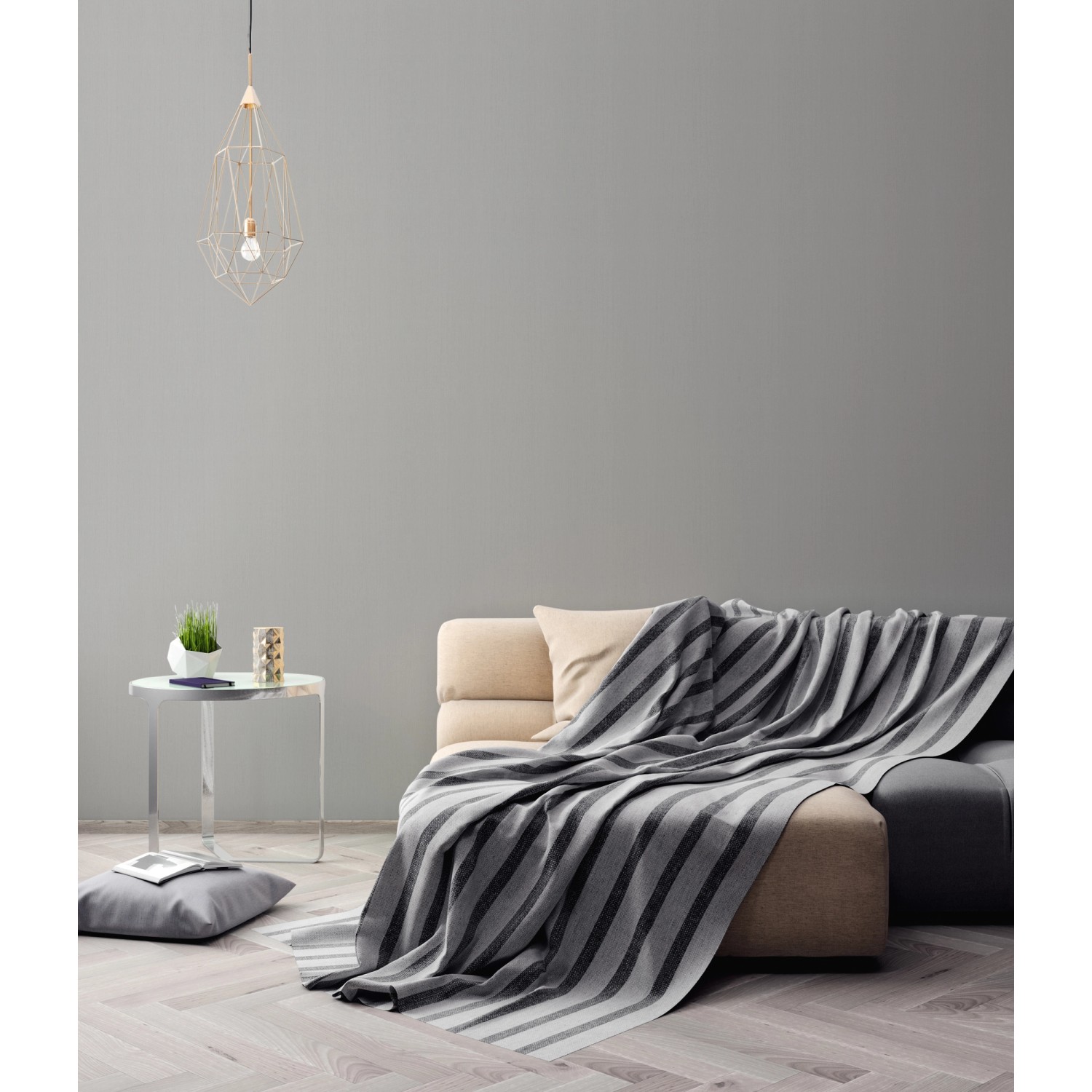 Wohnraum mit grauer AS-Creation Vliestapete Attractive Uni und Couch.