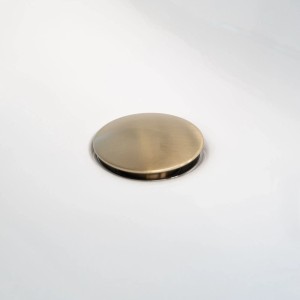 Detailaufnahme Ablaufgarnitur in Mattgold der Schöner Wohnen Waschtischarmatur Kadia.