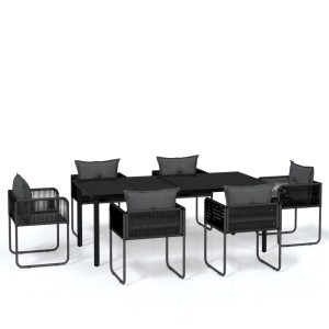 Schwarze 7-tlg. Garten-Essgruppe: Tisch mit Glasplatte und 6 Rattan-Stühle mit Kissen.