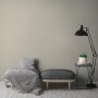 A.S. Création Vliestapete Uni Beige an Wand im Wohnraum mit Möbeln.