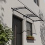 Modernes Palram Canopia Vordach Aquila 3 m in Grau/Klar schützt Hauseingang vor Wind und Wetter.