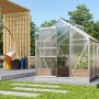 Gewächshaus Venus 3800 mit Alu-Rahmen und Fundament im Garten. Hohlkammerplatten, Schiebetür geöffnet.