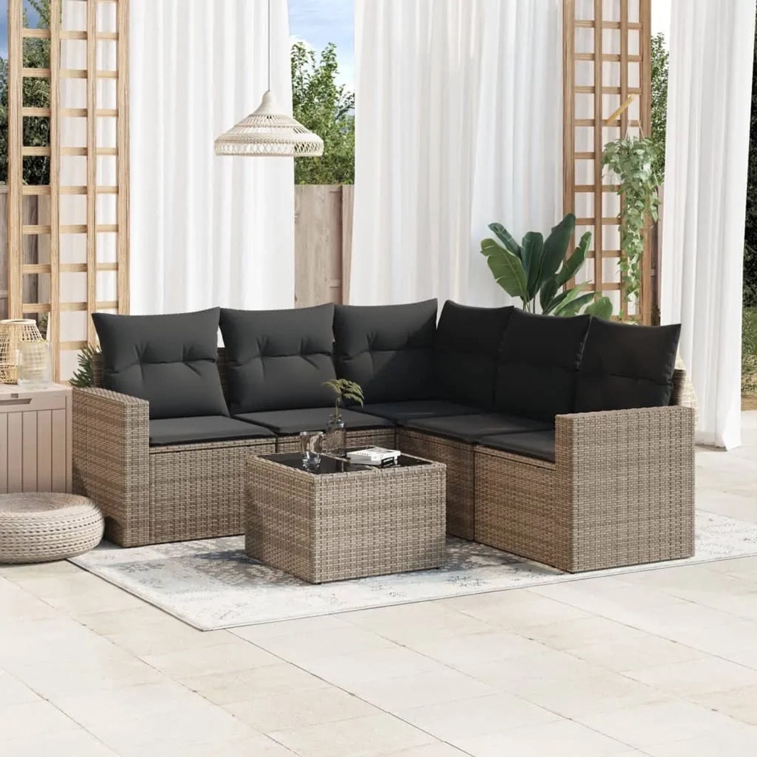 Graue 6-tlg. vidaXL Garten-Sofagarnitur aus Poly Rattan mit Kissen und Tisch.