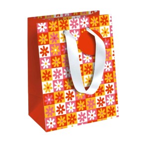 Bunte Clairefontaine Geschenktasche M mit Sunny Flowers Blumenmuster, roten Seiten und weißen Stoffhenkeln.
