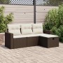 Braune 4-tlg. vidaXL Garten-Sofagarnitur aus Poly Rattan mit cremefarbenen Kissen.