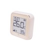 Shelly Temperatursensor Plus H&T G3 in Hellbeige zeigt Temperatur und Luftfeuchtigkeit an.