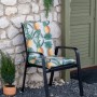 Beo Sitzauflage Niedriglehner Treffelstein mit Ananas-Motiv auf Gartenstuhl.