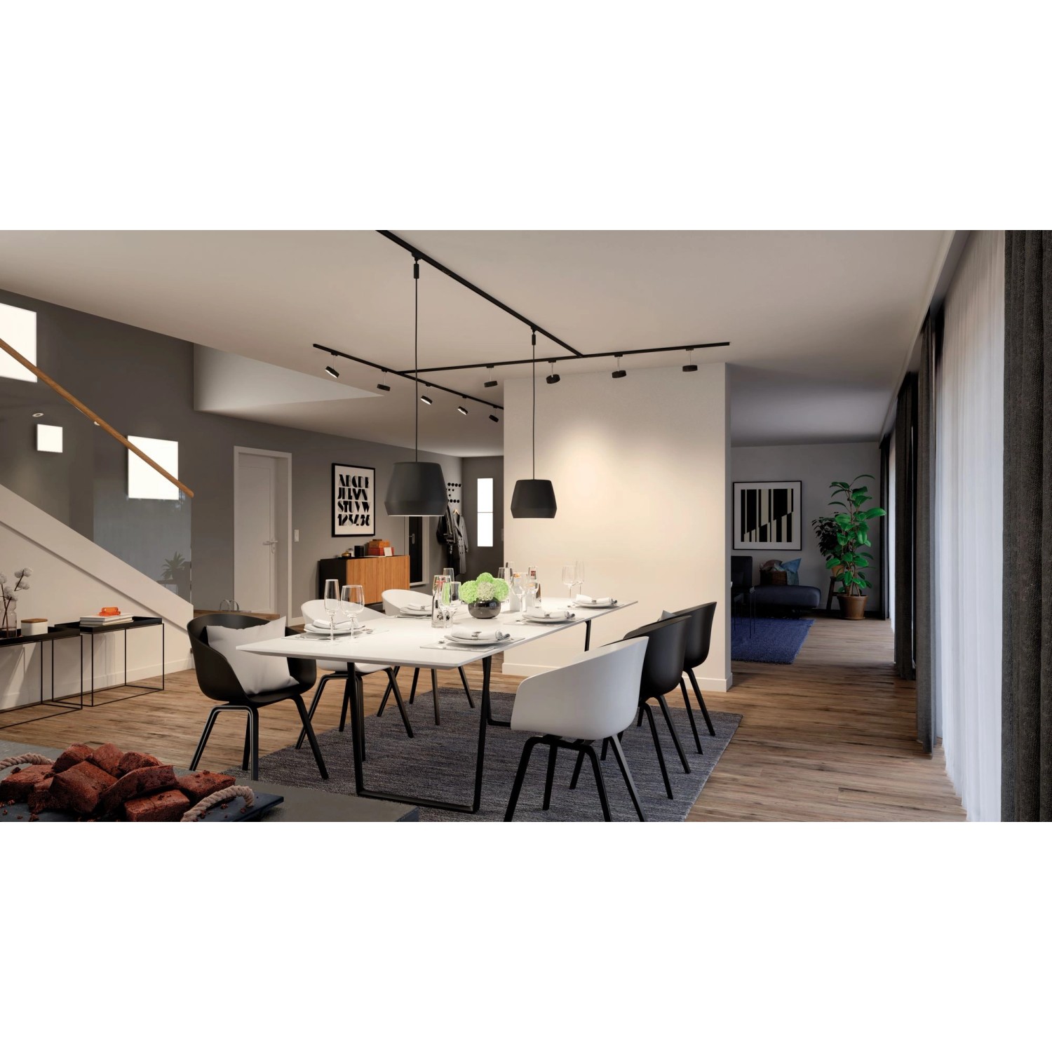 Esszimmer mit schwarzem URail Schienensystem und Pendelleuchten von Paulmann.