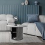 Runder Couchtisch in Beton-Optik Grau mit Schiebetür und Stauraum im modernen Wohnzimmer.
