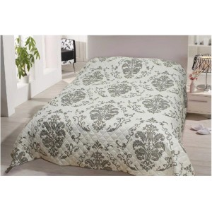 Bestlivings Tagesdecke Floria mit grauem Muster auf einem Bett.