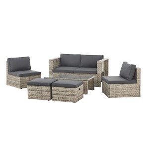 Graue Juskys Polyrattan Lounge Salou Gartenmöbel-Set mit Sofa, Sesseln, Hockern und Tisch.