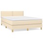 Cremefarbenes Boxspringbett 140x190 cm mit Matratze und Kopfteil.