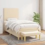 Cremefarbenes Boxspringbett (90x190 cm) mit Matratze, Kopfteil und Bank. Stoffbezug.