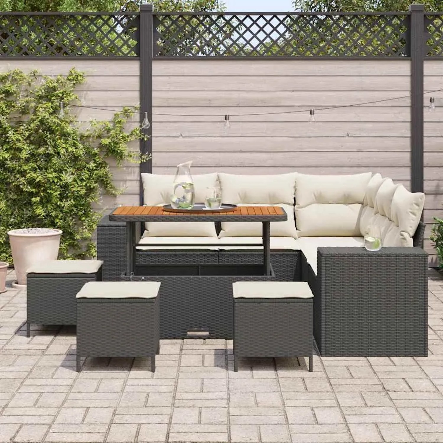 Schwarzes 9-teiliges Garten-Sofa-Set aus Poly Rattan von vidaXL mit Tisch und Hockern.