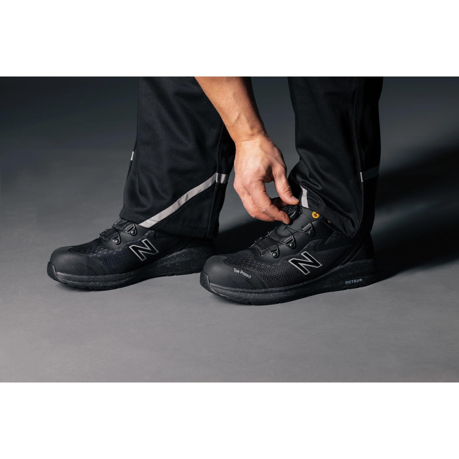 New Balance Logic BOA S1 PL Sicherheitsschuhe, schwarz-orange, mit BOA Fit System.