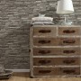 Graue A.S. Creation Vliestapete Dekora Natur 6 mit Steinmuster an der Wand.