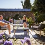 4-teiliges Lounge-Set Edna anthrazit mit Seilbespannung und beigen Auflagen für Garten oder Terrasse.