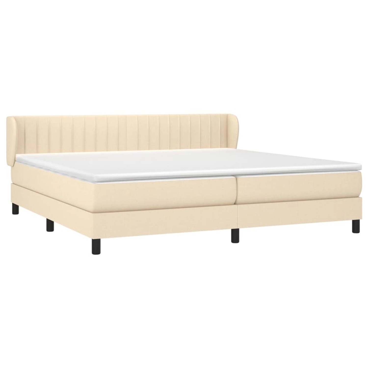 Cremefarbenes Boxspringbett 200x200 cm mit Matratze und Kopfteil.