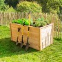 Westmann Hochbeet aus Lärche (170x90x84cm) mit Bepflanzung und Gartengeräten im Garten.