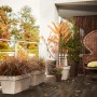 Hoher, weißer Elho Blumentopf Loft Urban (Ø 42 cm) mit Bepflanzung auf einer Terrasse.