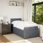 Dunkelgraues vidaXL Boxspringbett 100x200 cm mit Matratze und weißer Auflage im Schlafzimmer.